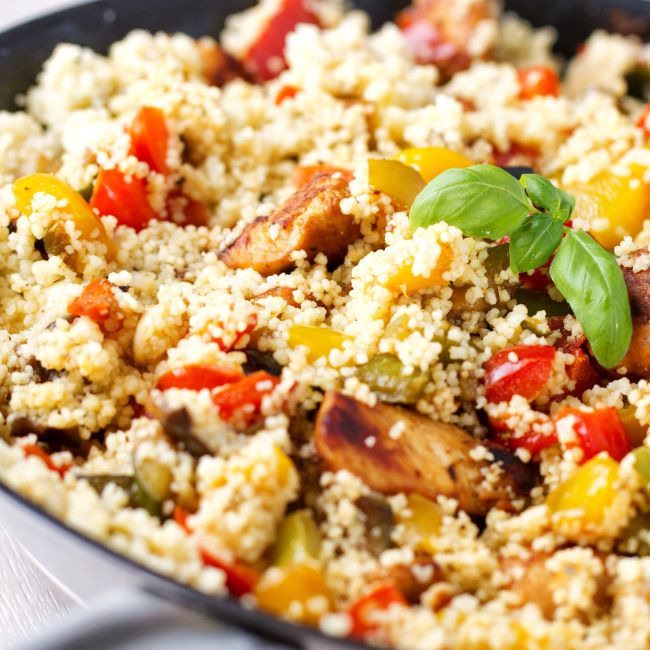 A bowl of chicken and roast vegetable couscous